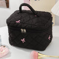 Bolsa de maquillaje portátil negra para mujer, bolsa de cosméticos acolchada con lazo rosa de gran capacidad, bolsa de almacenamiento de artículos de tocador de viaje para mujer