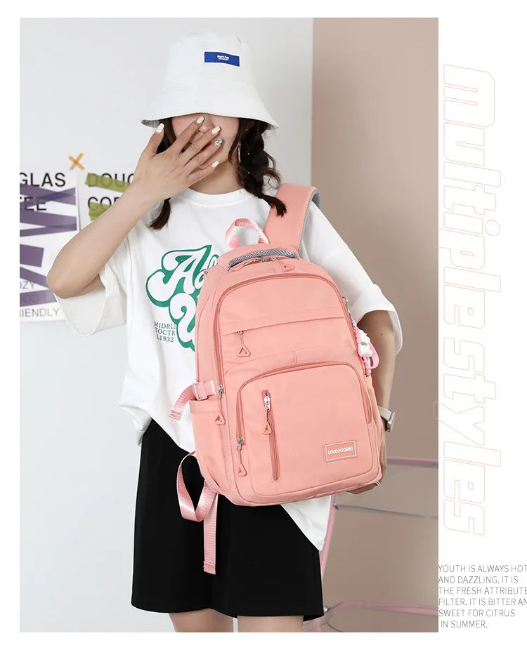 Mochila escolar de nailon con colgante para niñas, de viaje con múltiples bolsillos morral, impermeable, informal, estilo Simple