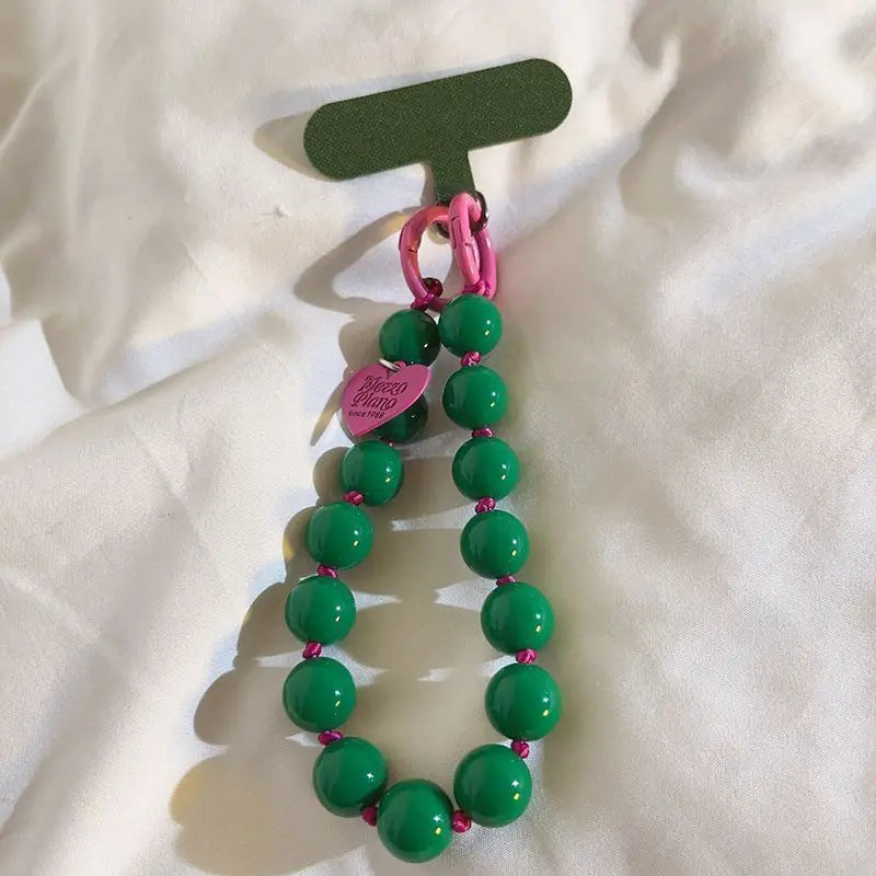 1 x Correa de muñeca unisex para teléfono móvil, sencilla y minimalista; disponible en 8 colores con dijes de cuentas en forma de corazón; versátil para móvil