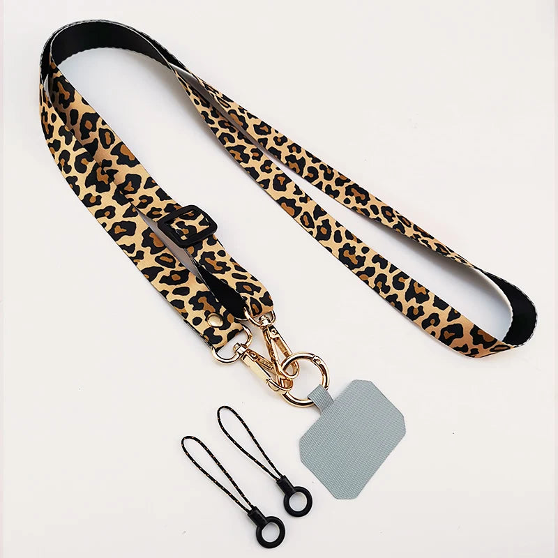Cordón cruzado para teléfono móvil, correa para el cuello, cordón para teléfono móvil con estampado de leopardo, cadena con junta Universal para todas las fundas de teléfono