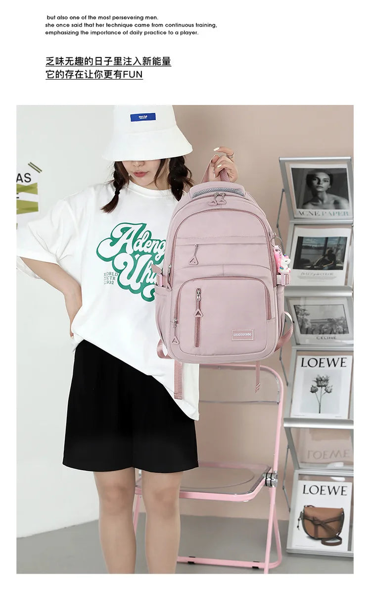 Mochila escolar de nailon con colgante para niñas, de viaje con múltiples bolsillos morral, impermeable, informal, estilo Simple