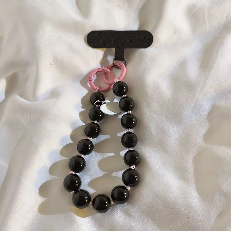 1 x Correa de muñeca unisex para teléfono móvil, sencilla y minimalista; disponible en 8 colores con dijes de cuentas en forma de corazón; versátil para móvil