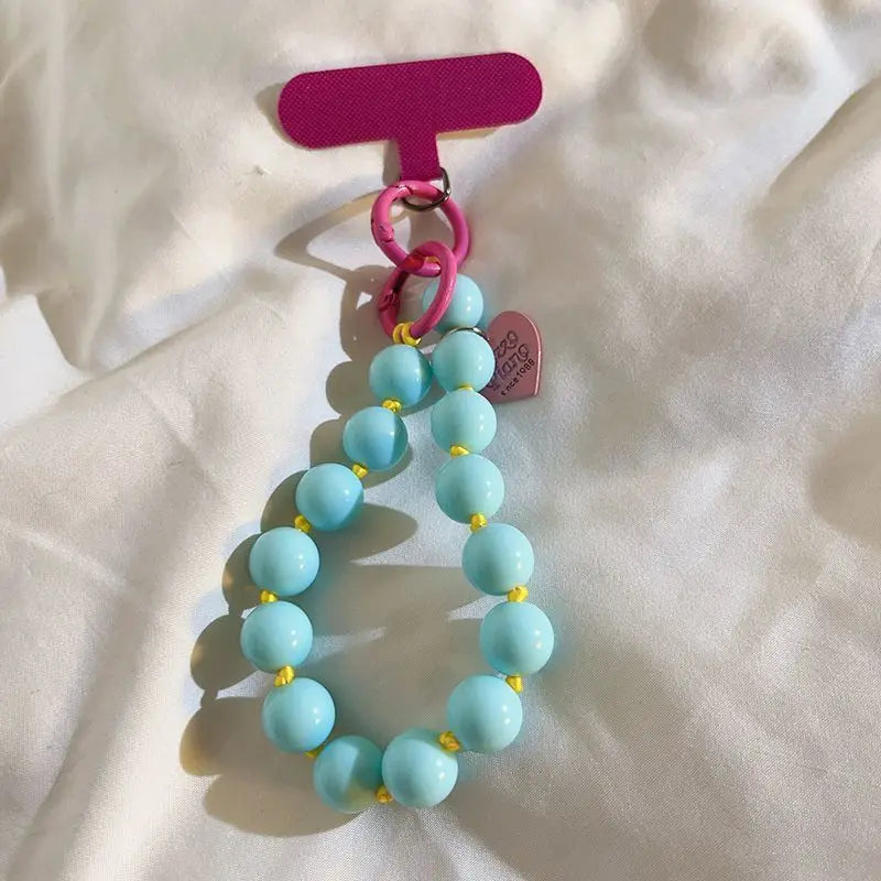 1 x Correa de muñeca unisex para teléfono móvil, sencilla y minimalista; disponible en 8 colores con dijes de cuentas en forma de corazón; versátil para móvil