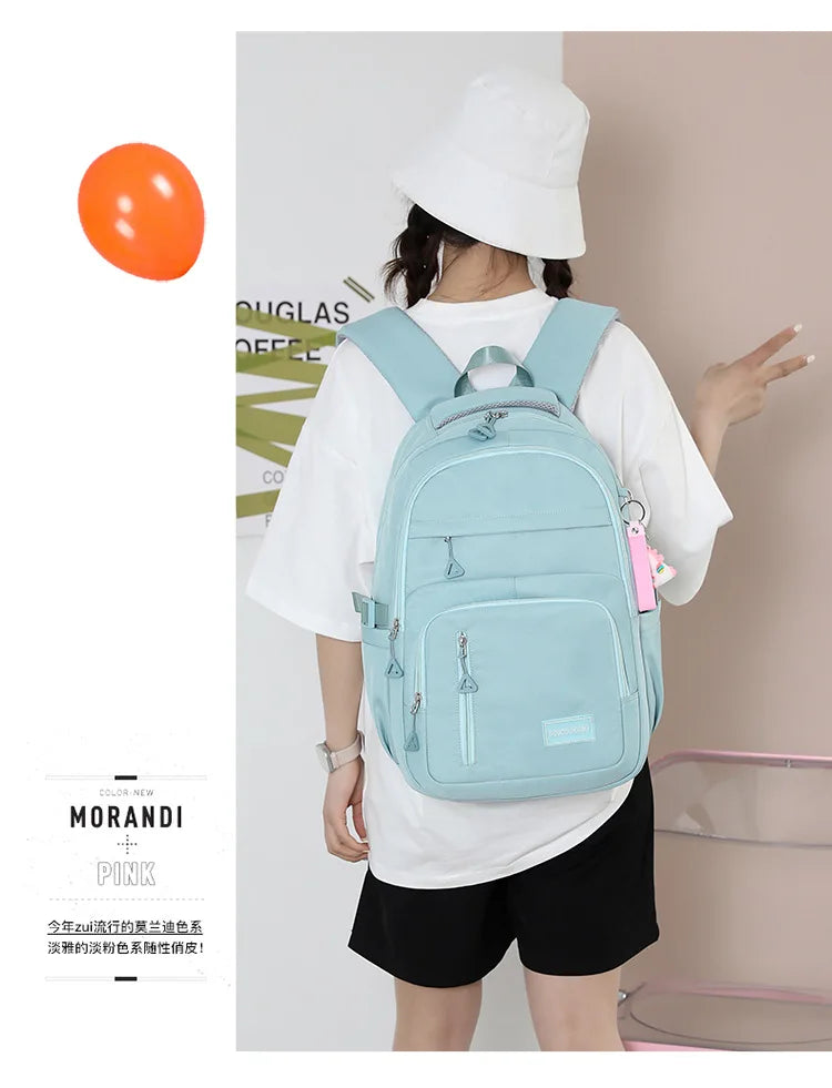 Mochila escolar de nailon con colgante para niñas, de viaje con múltiples bolsillos morral, impermeable, informal, estilo Simple