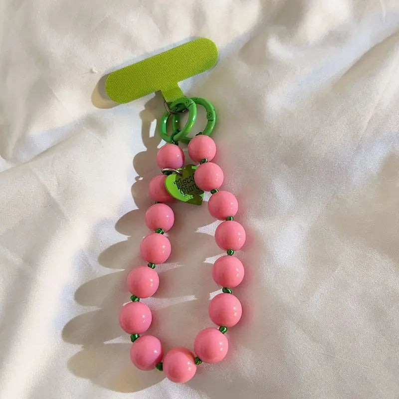 1 x Correa de muñeca unisex para teléfono móvil, sencilla y minimalista; disponible en 8 colores con dijes de cuentas en forma de corazón; versátil para móvil