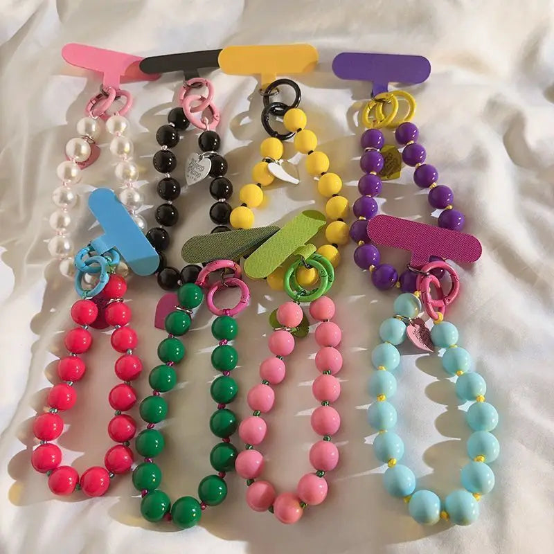 1 x Correa de muñeca unisex para teléfono móvil, sencilla y minimalista; disponible en 8 colores con dijes de cuentas en forma de corazón; versátil para móvil