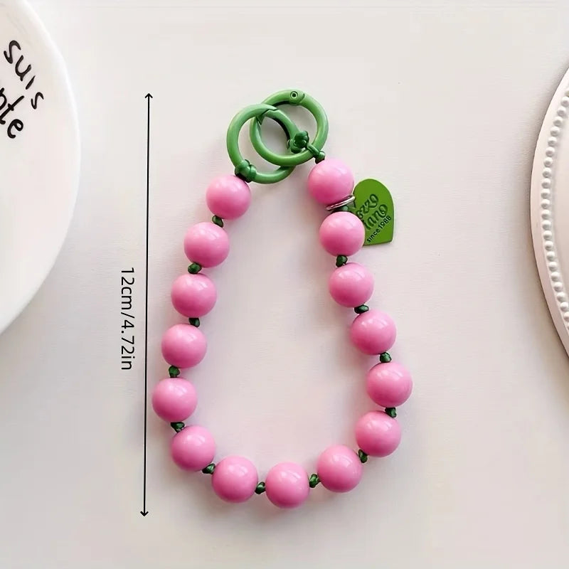 1 x Correa de muñeca unisex para teléfono móvil, sencilla y minimalista; disponible en 8 colores con dijes de cuentas en forma de corazón; versátil para móvil