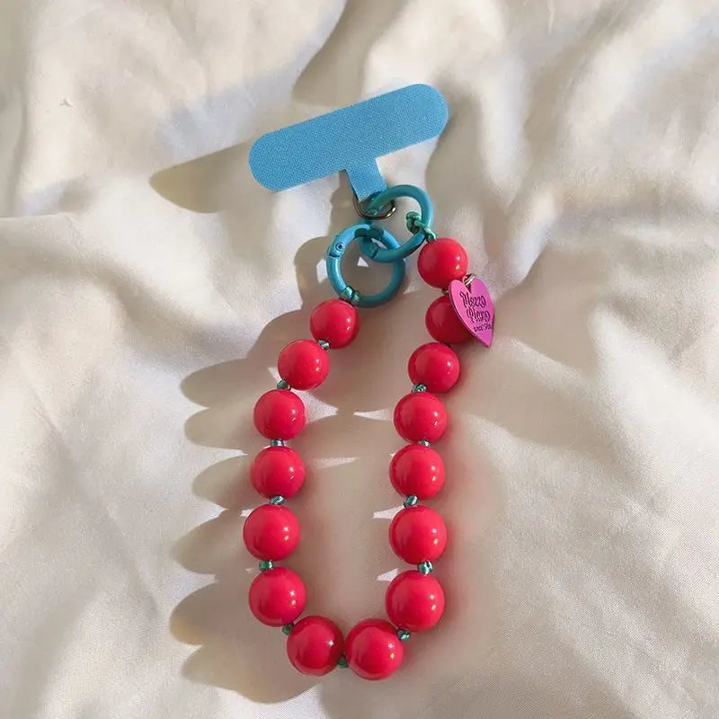 1 x Correa de muñeca unisex para teléfono móvil, sencilla y minimalista; disponible en 8 colores con dijes de cuentas en forma de corazón; versátil para móvil