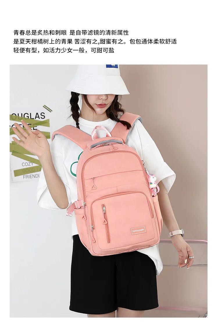 Mochila escolar de nailon con colgante para niñas, de viaje con múltiples bolsillos morral, impermeable, informal, estilo Simple