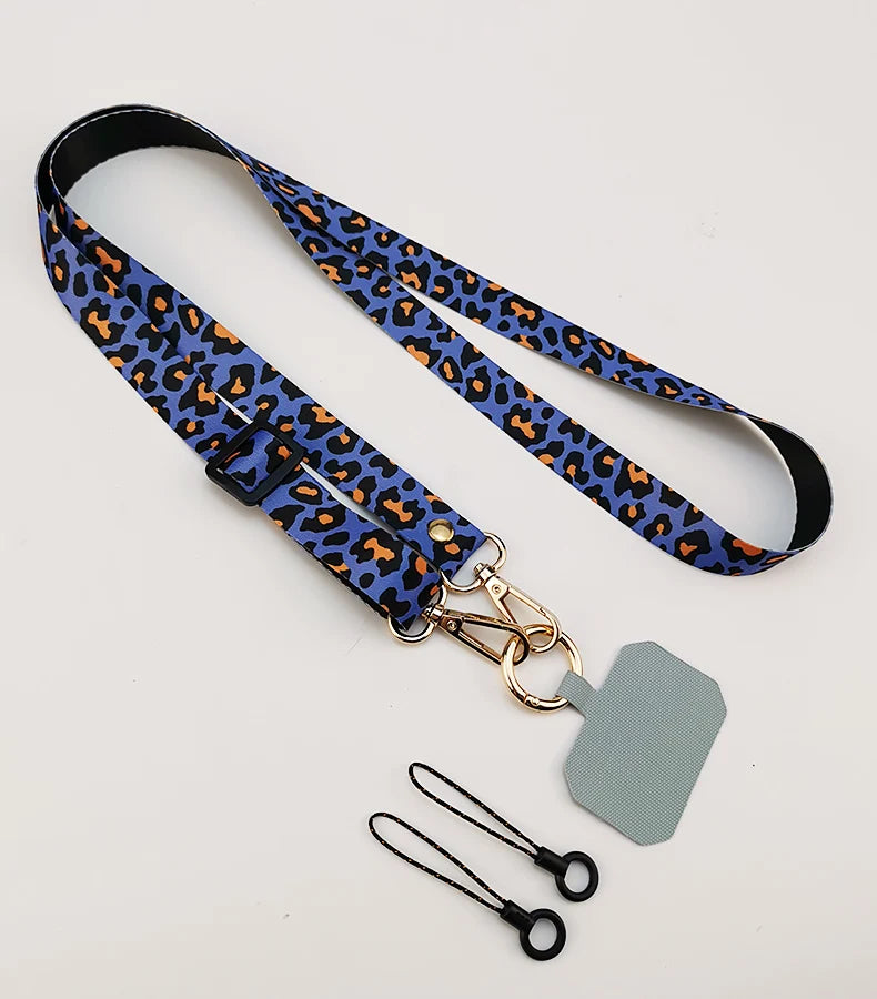 Cordón cruzado para teléfono móvil, correa para el cuello, cordón para teléfono móvil con estampado de leopardo, cadena con junta Universal para todas las fundas de teléfono